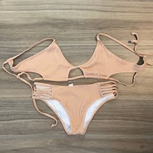 strappy nude bathing suit